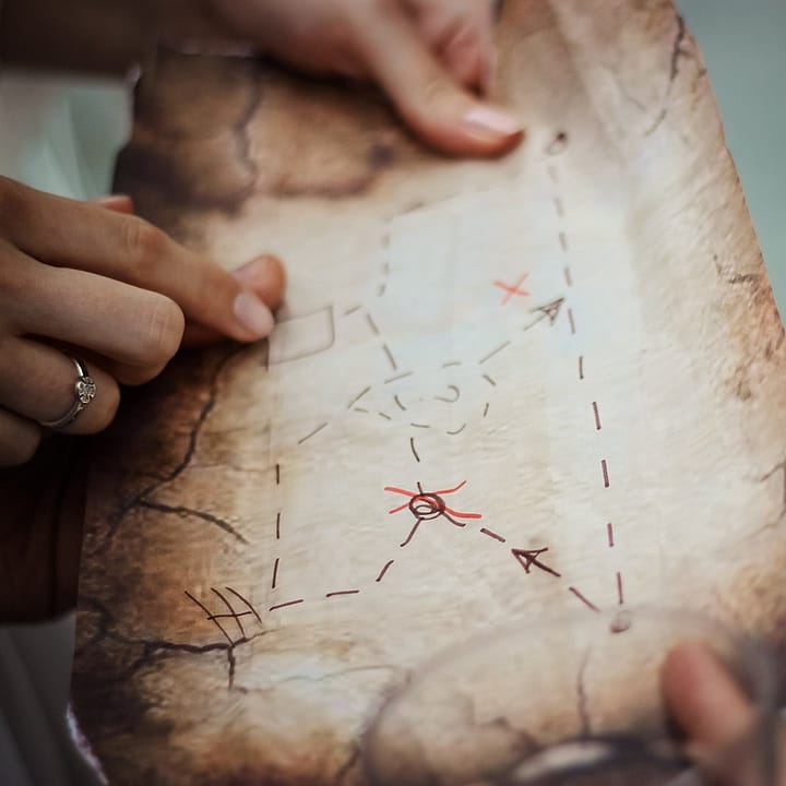 couple reading a treasure map